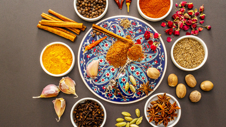 Colorful spice mix surrounding blue floral plate