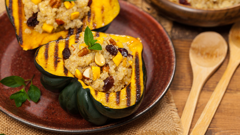 A cooked acorn squash on a plate