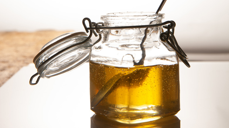 A glass jar of agave syrup