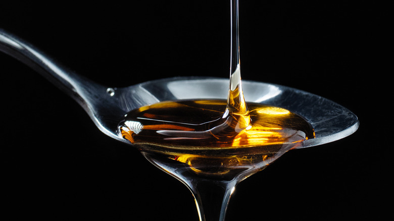 Agave nectar being poured onto a spoon