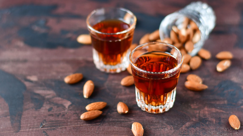 Amaretto glasses surrounded by almonds