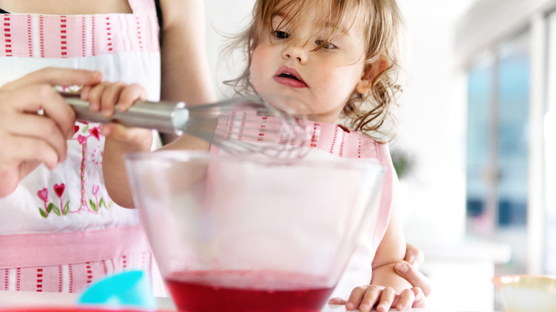 Toddler helping make Jell-O