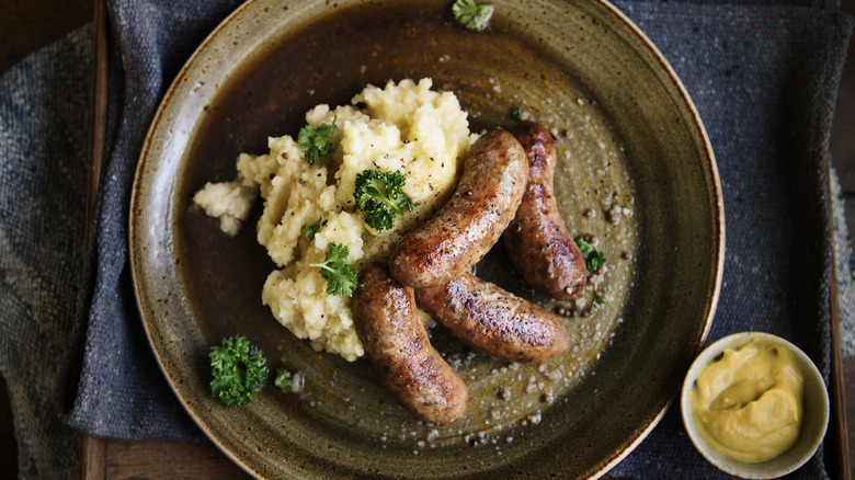 plated bangers and mash with mustard