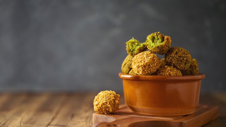 falafel balls on wooden table