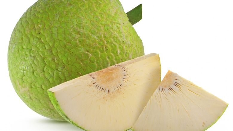 Whole breadfruit with slices of breadfruit