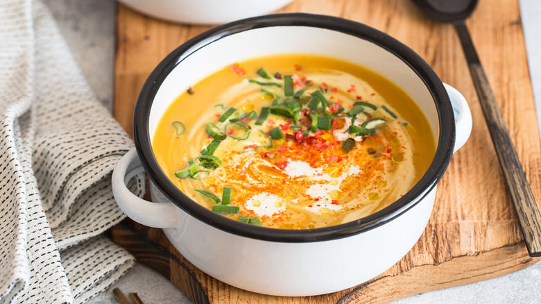 Calabaza squash soup in a white pot