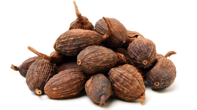 black cardamom on white background