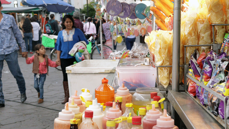 Mexican food cart with sauces