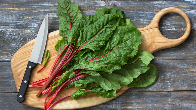 Chard on a cutting board with a knife