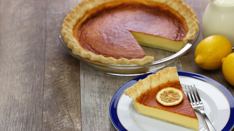 Chess pie on a table with lemons