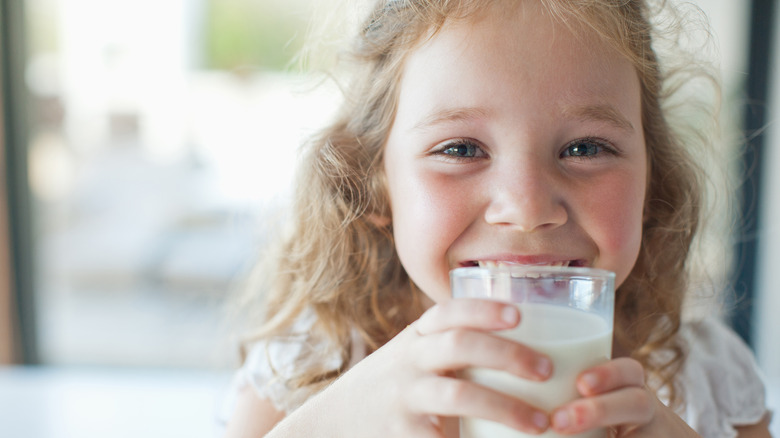 little girl drinking milk