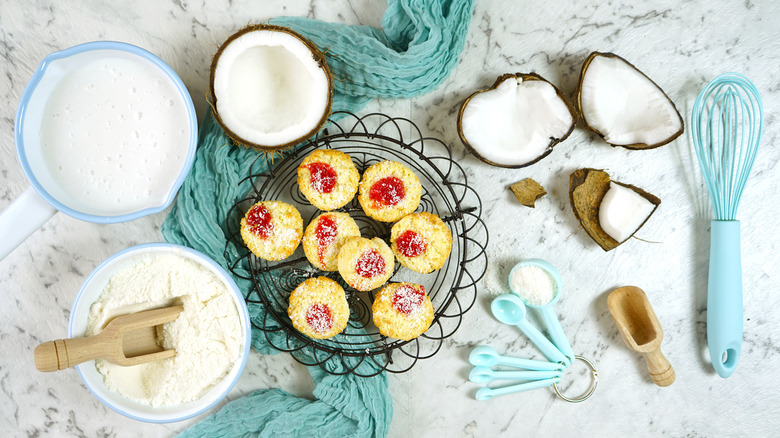 Top view of cookies, coconuts, and measuring spoons