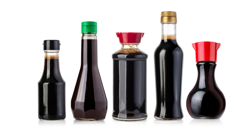 Bottles of soy sauce against a white background