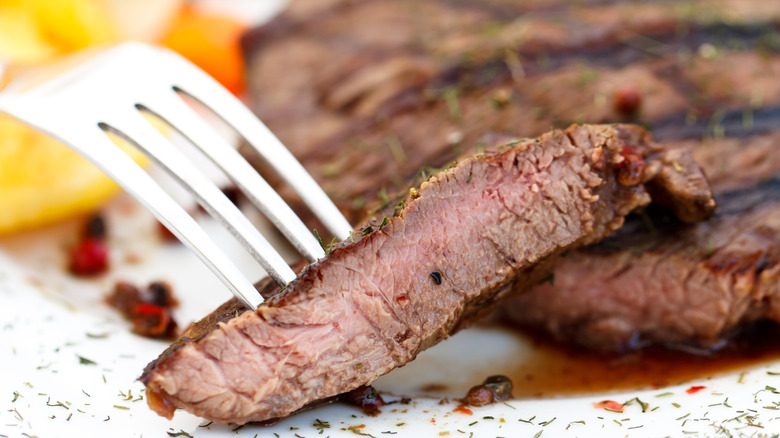 Sliced steak on fork