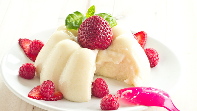 Flummery on a plate topped with a strawberry