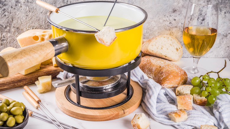 Yellow traditional fondue pot