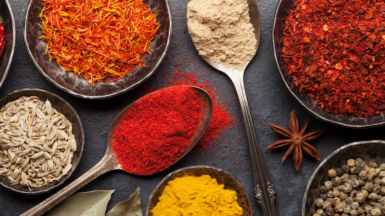 Indian spices in bowls, spoons