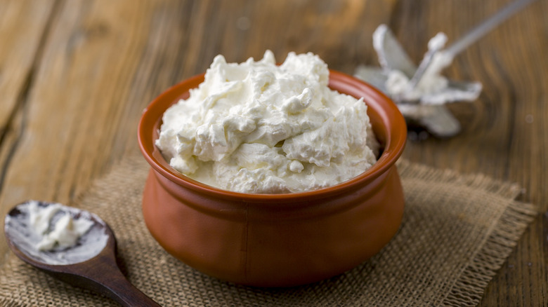 Freshly white butter in jar 