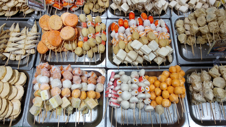 Frozen kamaboko on skewers at the market