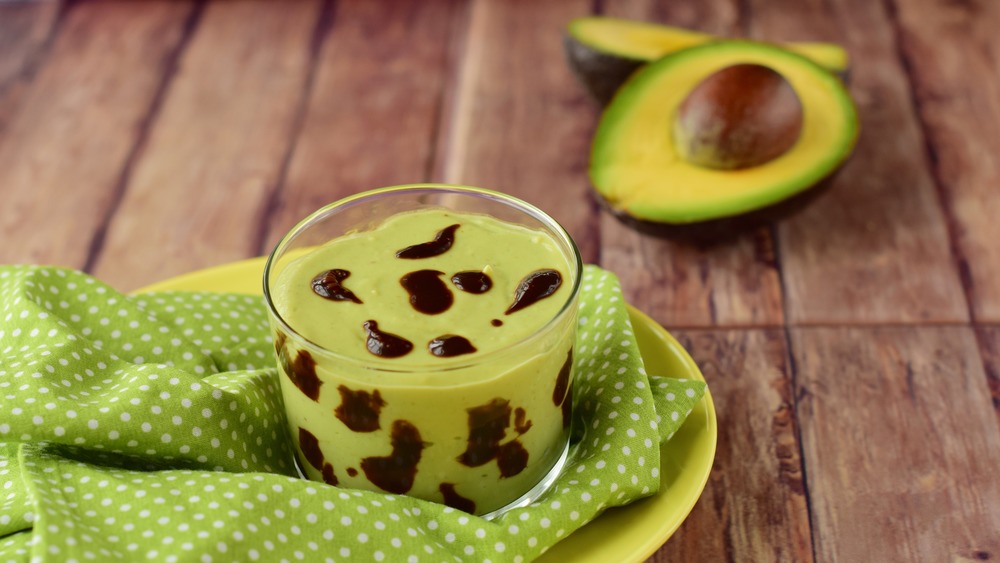 Avocado drink with chocolate on a towel