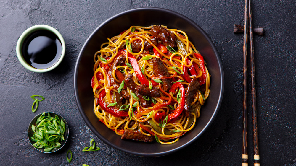 bowl of noodles with kecap manis and scallions