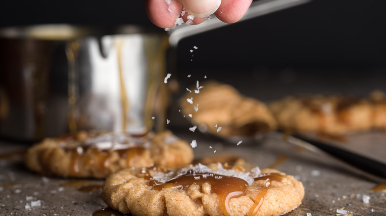 Sprinkling salt on cookies