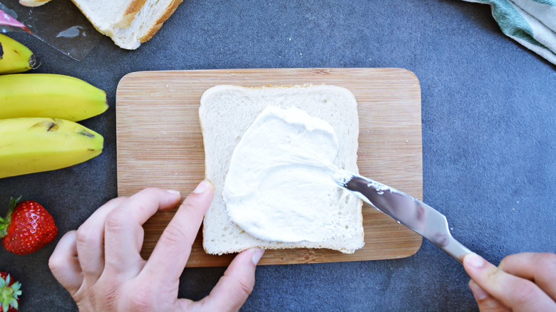 Marshmallow creme on toast surrounded by fruit