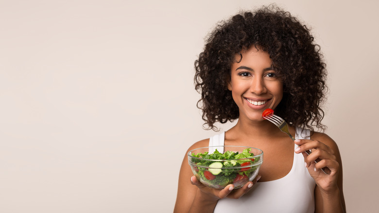 Woman eating healthy salad