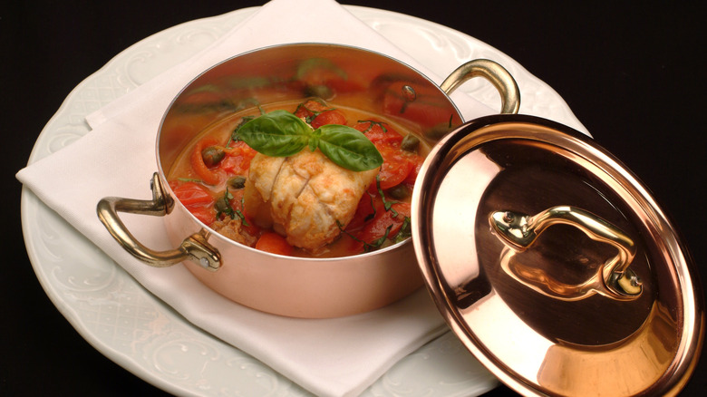 Stewed monkfish in a copper saucepan