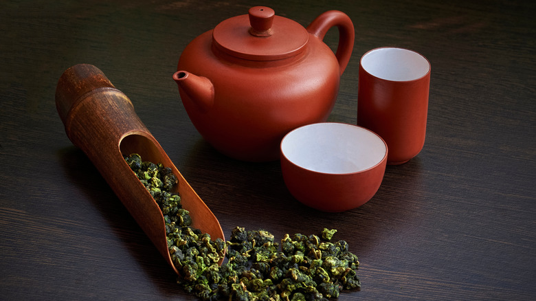 Red tea pot with loose leaf tea