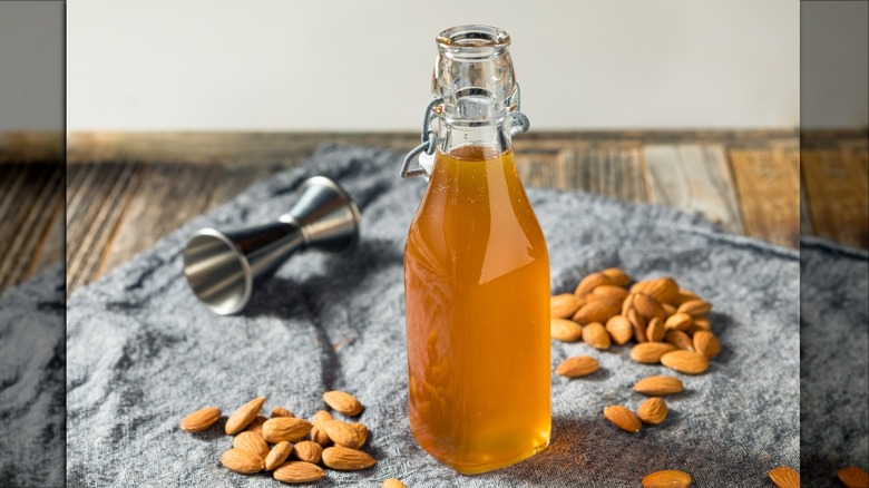 Homemade orgeat in bottle with almonds