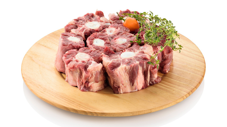 raw oxtail on cutting board