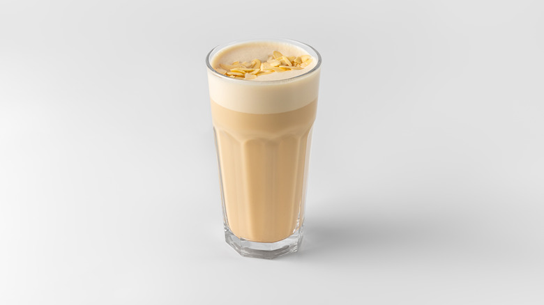 A glass of Raf coffee on white background