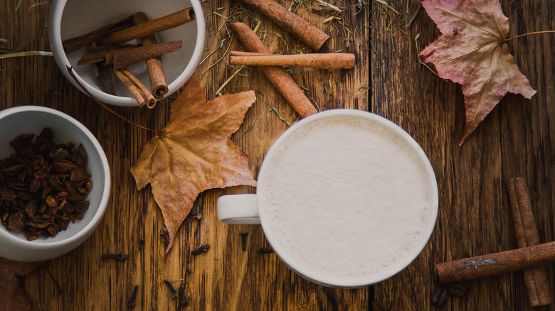 A cup of Raf coffee with spices around it