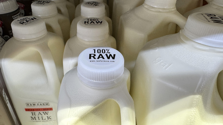 Raw milk in bottles on a store shelf