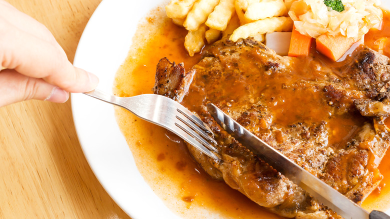 Steak with sauce and fries