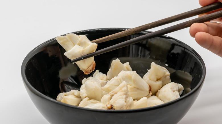 Crab meat in a black bowl