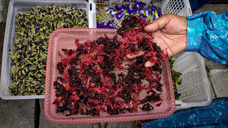 Harvested roselle on a red clay tray in India