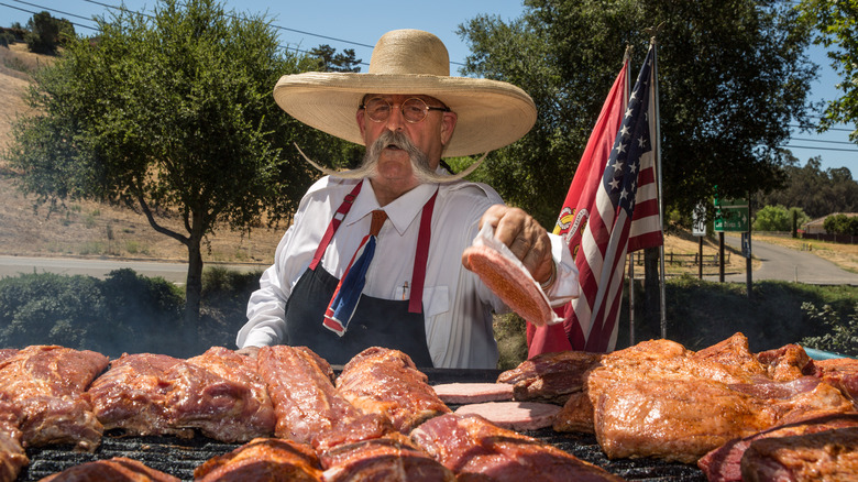 Man grilling Santa Maria-style barbecue 