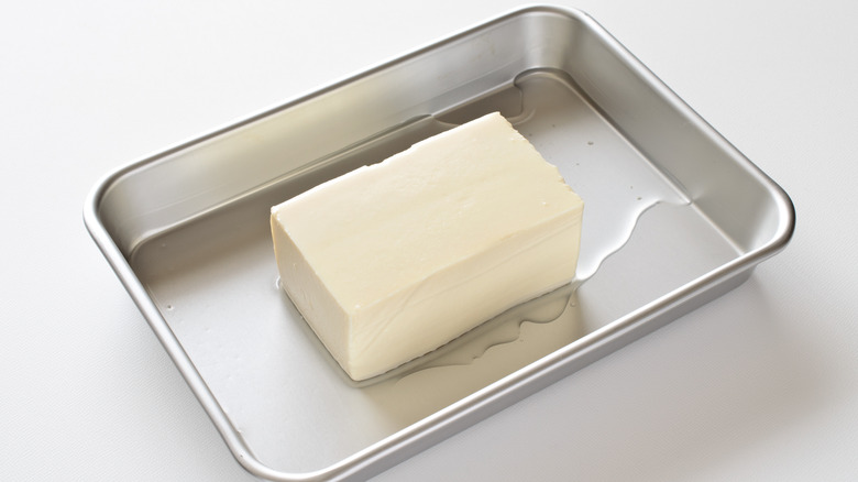 Silken tofu draining on a dish