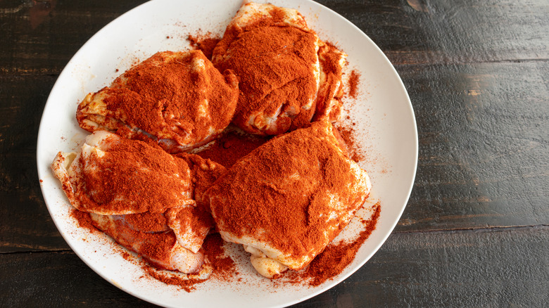 Chicken thighs dredged in paprika