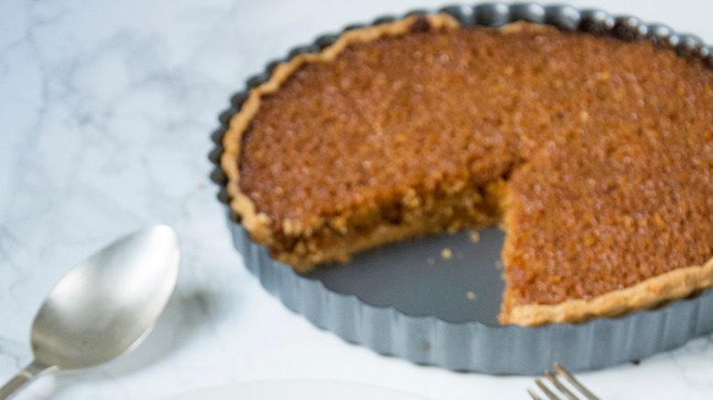 treacle tart in grey tin