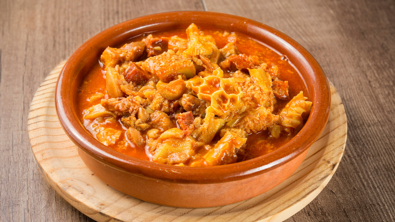 Spanish tripe with tomato sauce in a terracotta dish