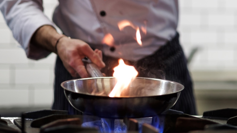 cooking pan over flame