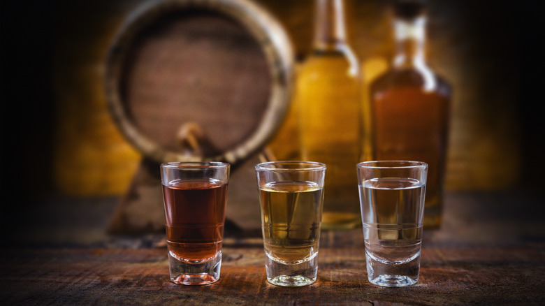 Shot glasses with different colored alcohol