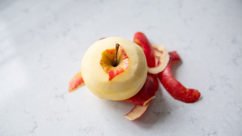 A peeled red apple shot from above 