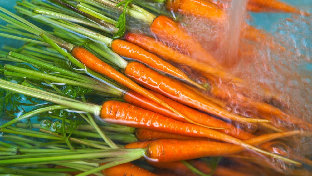 Carrots soaking in water