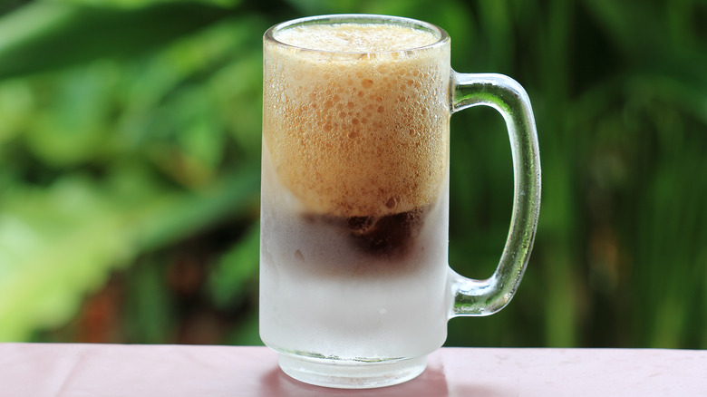 mug of root beer with foam