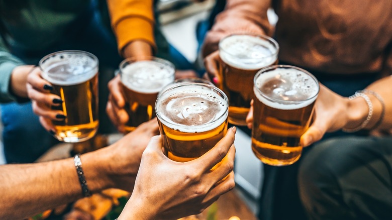 Group of friends toasting beers