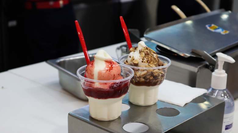 Two cups of ice cream with toppings at contemporary Dairy Queen